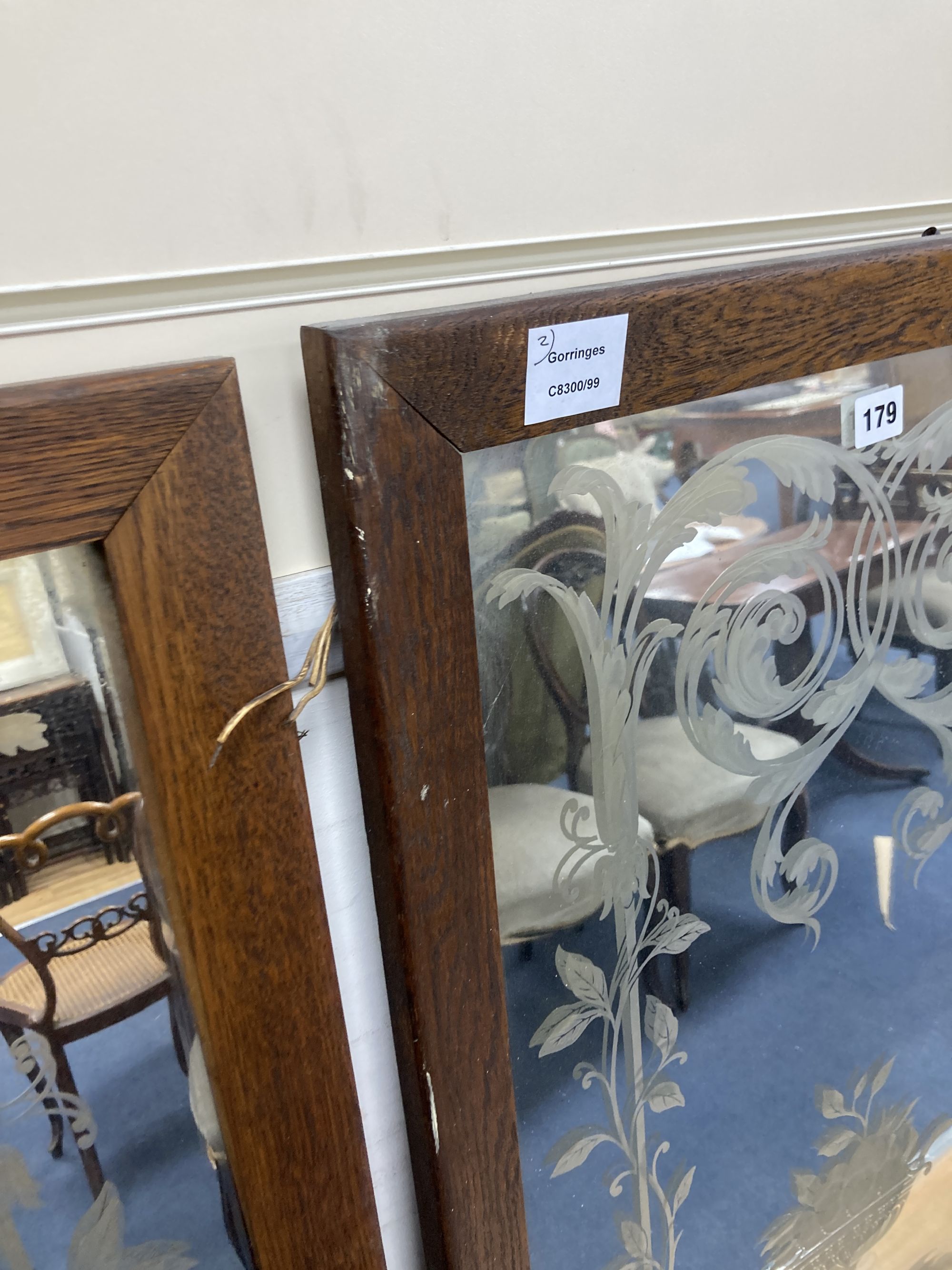 A pair of Victorian oak framed etched glass panels, width 55cm height 144cm